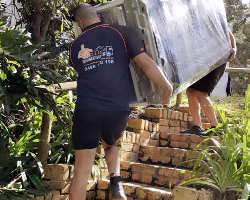 House removalists in Sydney moving furniture into a new family home