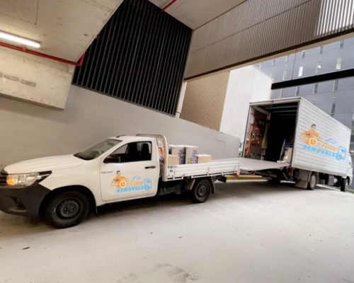 Experienced movers assisting with furniture disassembly and reassembly