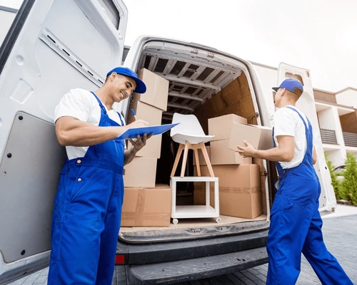 Professional movers transporting bedroom furniture and packed boxes