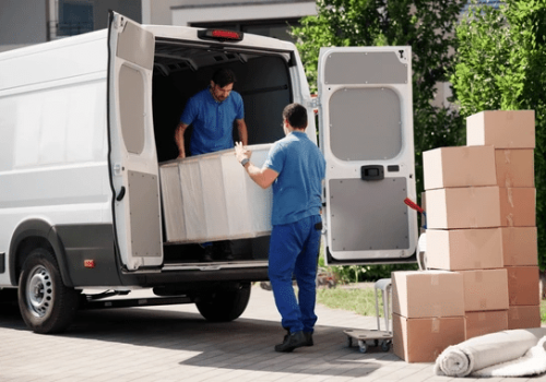 Professional home moving team handling packed boxes and personal belongings
