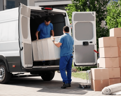 Professional home moving team handling packed boxes and personal belongings