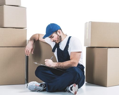Experienced removalists transporting personal belongings in secure cartons